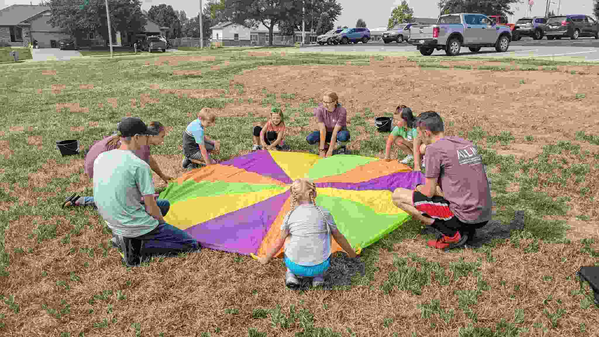Kids and teens with parachute 1